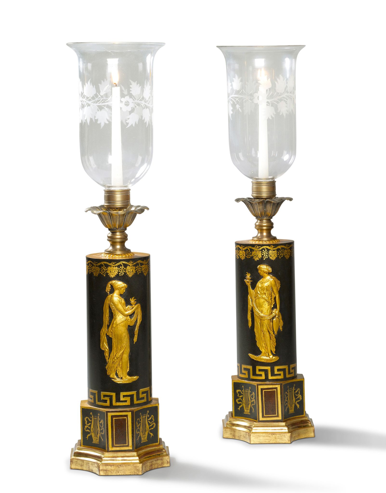 A Pair of Regency Tole Lamps England circa 1810, with cylindrical bodies decorated with gilded