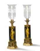 A Pair of Regency Tole Lamps England circa 1810, with cylindrical bodies decorated with gilded