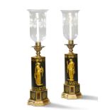 A Pair of Regency Tole Lamps England circa 1810, with cylindrical bodies decorated with gilded