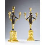 A Pair of Empire Three Branch Bronze and Gilt Candelabrum France circa 1810, in the form of bronze