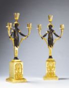 A Pair of Empire Three Branch Bronze and Gilt Candelabrum France circa 1810, in the form of bronze