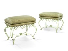 A Pair of 1940's Cast Iron Stools France circa 1940, with stylized cabriole legs joined by a