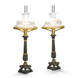 A Pair of Sinumbra Lamps France circa 1820, the fluted columns standing on a tripod of claw feet,