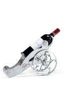 A Bottle Pourer England circa 1880, the sides lavishly engraved with floral ornament and the