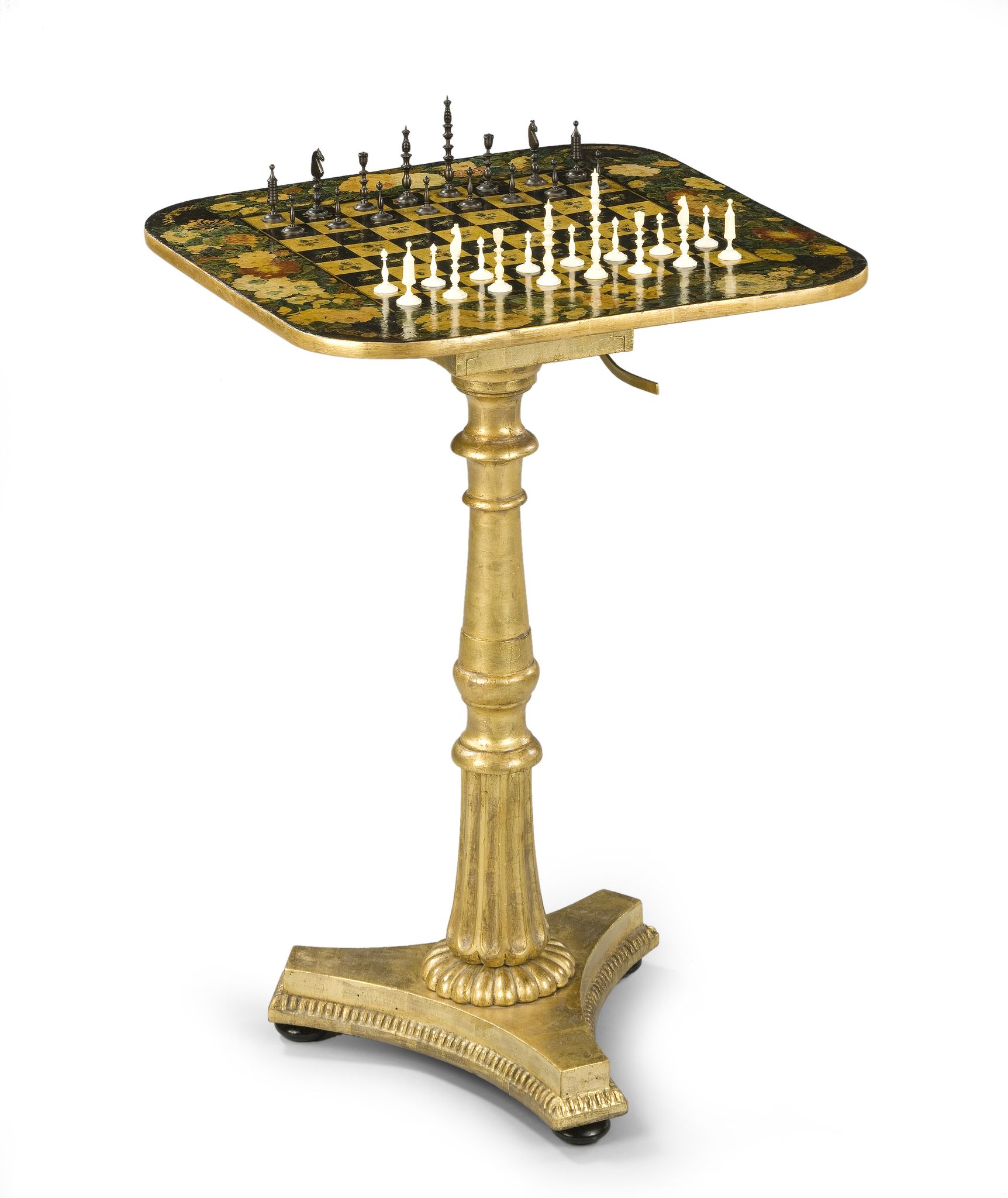 A Regency Tilt-Top Games Table England circa 1830, the board is enriched with armorial motifs