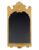 A George I Gesso Mirror England circa 1720,  the shaped and bevelled plate contained within a carved