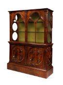 An Unusual 20th Century Mahogany Gothic Display Cabinet. England circa 1840, having glazed lancet