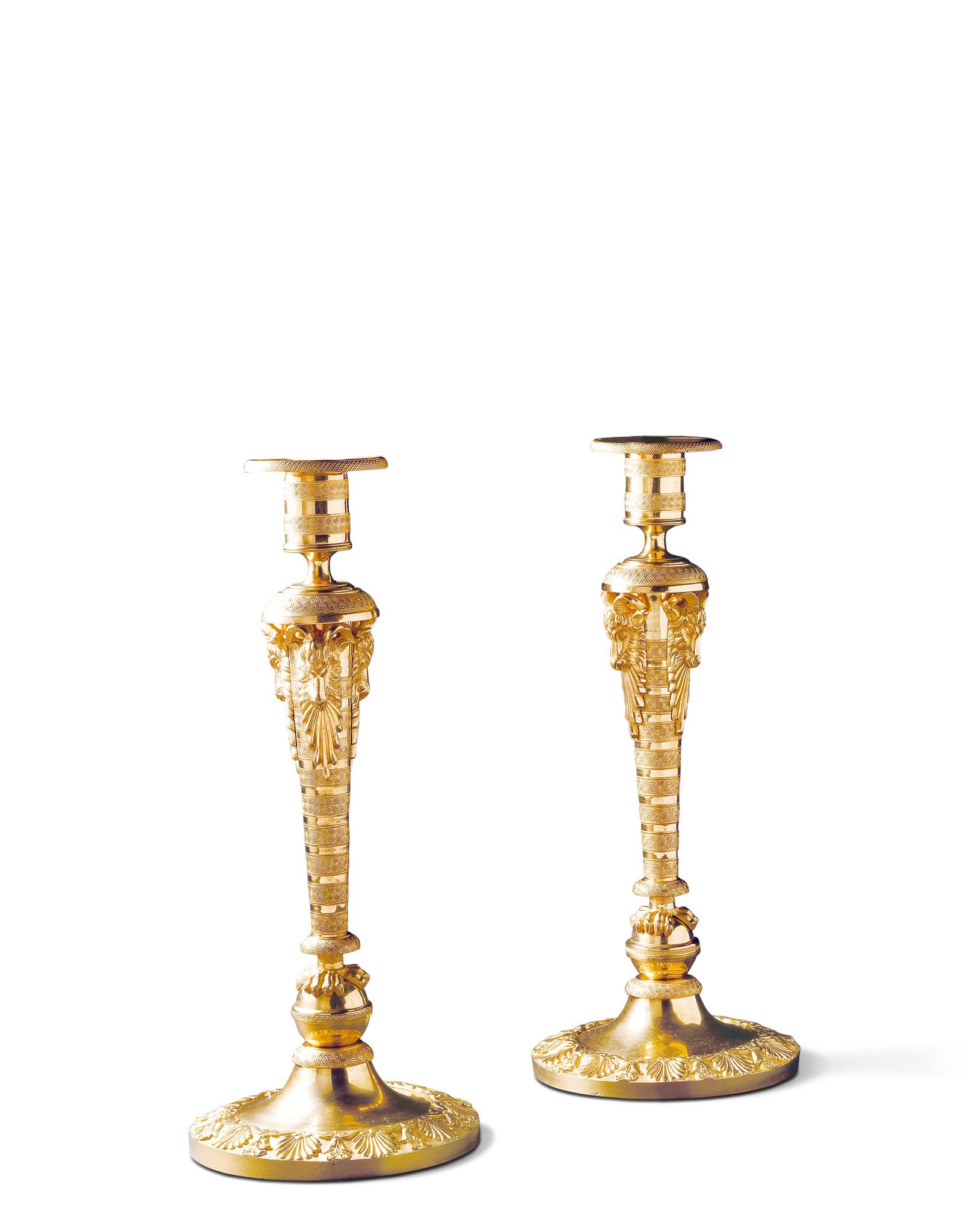A Pair of Russian Candlesticks Russia circa 1810, with finely turned and crisply cast ornament,
