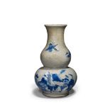 A Gourd Vase China, circa 1850, of double gourd form, decorated in underglaze blue, restored ,