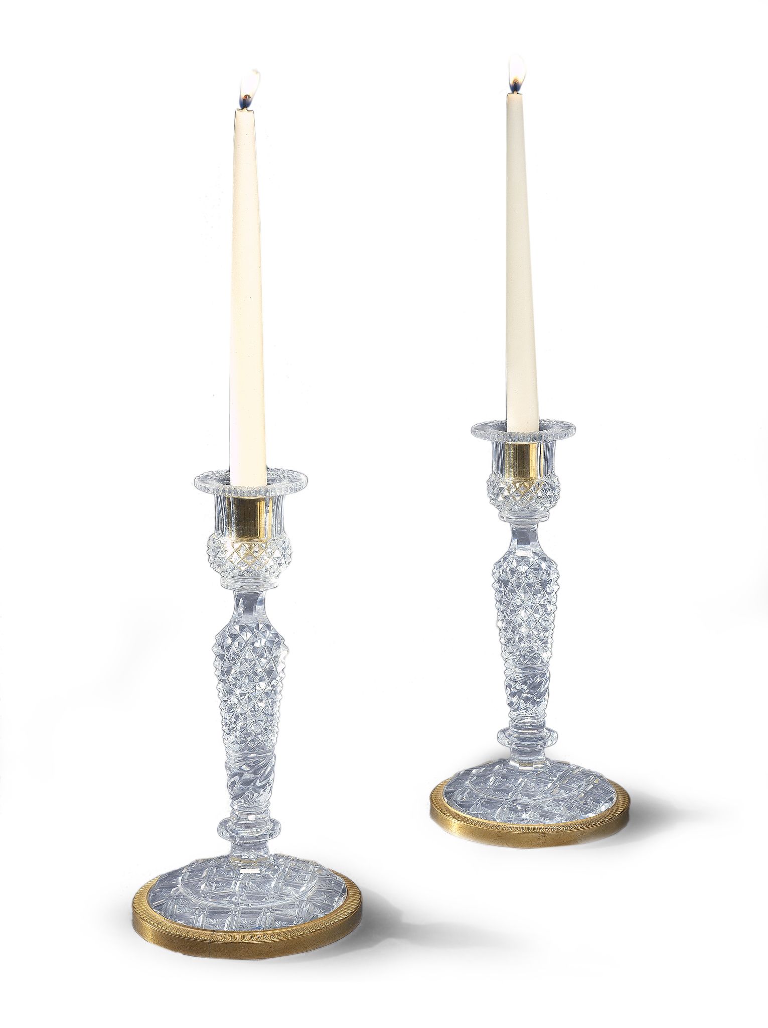 A Pair of Baccarat Glass and Ormolu Candlesticks France circa 1810, the form taking that of a gilt