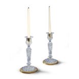 A Pair of Baccarat Glass and Ormolu Candlesticks France circa 1810, the form taking that of a gilt