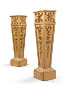 A Pair of Giltwood Pedestals England circa 1850, of tapering form with garlands of C srolls and