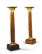 A Pair of Palmwood Pedestals England circa 1870, each with an elaborate lacquered brass  C orinthian