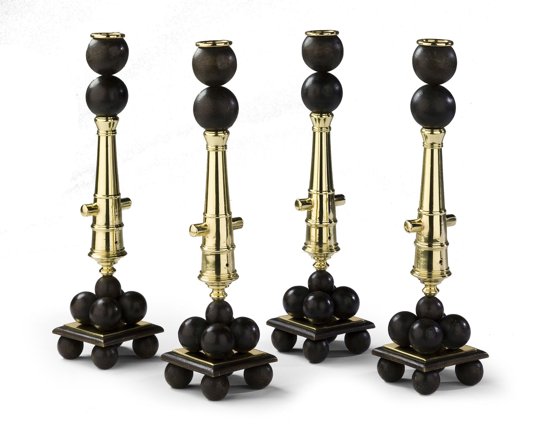 A Rare Set of Four Candlesticks 19th century, modelled in the form of cannon,      supported on a