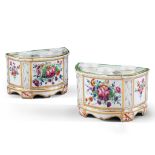 A Pair of Porcelain Cache Pots France ,  painted with classical motifs and floral cartouches, the