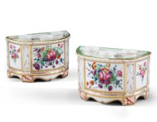 A Pair of Porcelain Cache Pots France ,  painted with classical motifs and floral cartouches, the