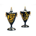 A Pair of Black and Gold Chestnut Urns Low countries circa 1790,  of traditional schooner form,
