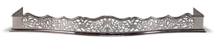 A George III Polished Steel Fender England circa 1780, with pierced and engraved Rococo decoration