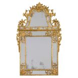 A Fine Regence Giltwood Pier Mirror France circa 1730, the cresting is enriched with carved scrolls,