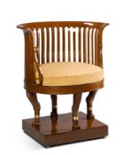 An Empire Mahogany Desk Chair Continental circa 1815, of horse-shoe shape and with a curious