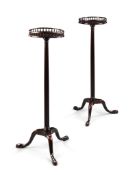 A Pair of George III Mahogany Torcheres England circa 1760, having circular galleried tops supported