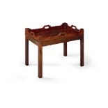 A Mahogany Tray Table England circa 1800, the shaped gallery with pierced carrying handles,