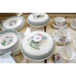 A Susie Cooper part dinner service, green border and floral decorated, to include dinner plates,