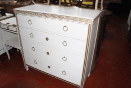 A white painted bedroom suite with gold Greek key pattern detail , to include a wardrobe, chest of