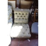 An upholstered Victorian low nursing chair, circa 1860 and a Victorian rosewood card table raised on