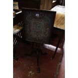 A 19th century mahogany pole screen, with a glazed needle work screen depicting a Phoenix amongst