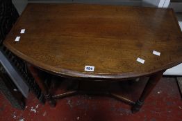 A Victorian mahogany bowfronted side table and a two carved South East Asian panels