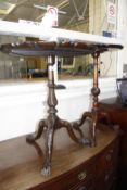 A George III style piecrust mahogany occasional table with spiral twist baluster column and carved