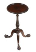 A mahogany wine table in George III style, 20th century, the circular top above twist stem and