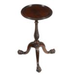 A mahogany wine table in George III style, 20th century, the circular top above twist stem and