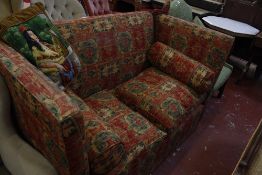A two seat Knole sofa in red and green kelim style upholstery.153cm wide.