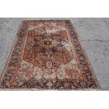 An antique Persian Heriz carpet 309 x 224cm