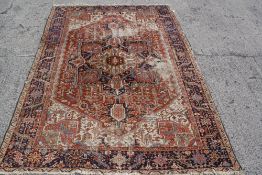 An antique Persian Heriz carpet 309 x 224cm