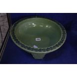 A Chinese green bowl on three short legs, decorated with dragon, 34cm in diameter Best Bid