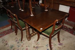 An oak draw leaf refectory table raised on bobbin turned supports. 128cm or 227 cm long x 100cm