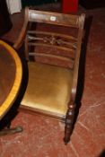 A George III style mahogany armchair together with a side chair, and two further dining chairs,