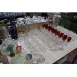 A quantity of assorted drinking glasses and decorative glass items, to include a set of thistle