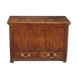 A George III oak mule chest, circa 1770, the lift top opening to large compartment with triple panel