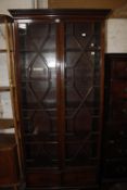 A George III style glazed mahogany bookcase 193cm high, 87cm wide