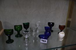 A collection of assorted glass eye baths and one ceramic bath -11 Best Bid