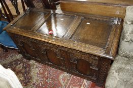 A late 19th century carved oak plank chest, 115cm in length