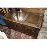 A late 19th century carved oak plank chest, 115cm in length