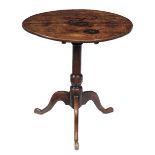 An oak tripod table, early 18th century, the oval tilt top above turned stem and tripod base, 71cm