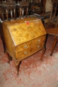 A 20th century walnut bureau with two short drawers and cabriole legs Best Bid