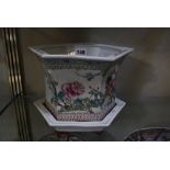 A Chinese famille rose jardiniere and stand, hexagonal shaped, 17cm high, a Japanese blue and