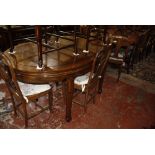 A Chinese hardwood dining table 169cm length and a set of six hardwood dining chairs to include